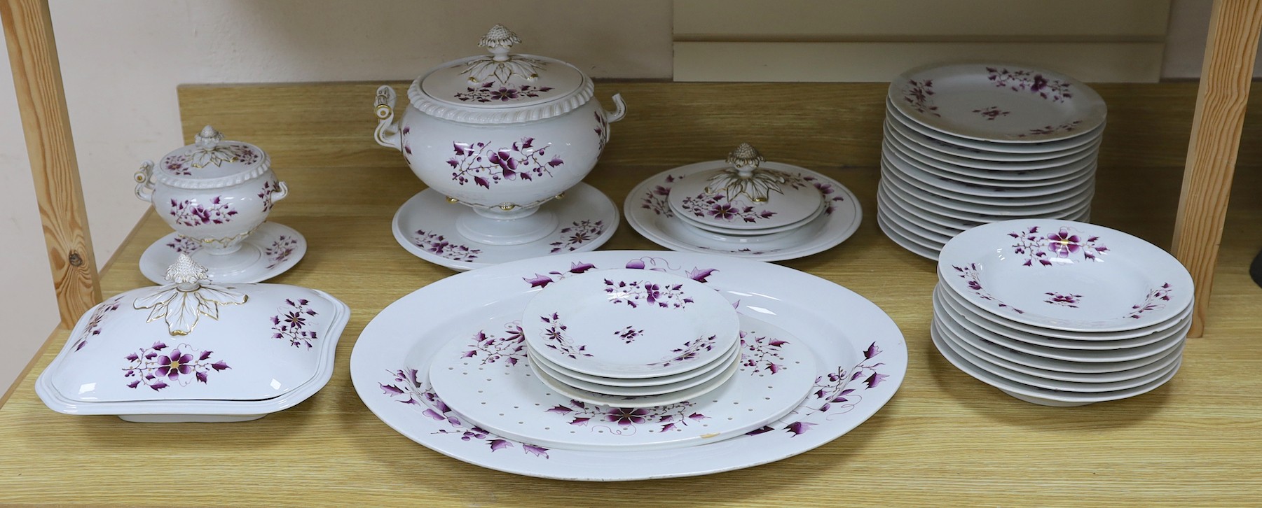 A Flight Barr and Barr floral and gilt decorated part dinner service